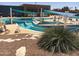 Community pool area with multiple pools and shade structures at 12619 N Sun Valley Dr, Sun City, AZ 85351