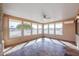 Sunroom features tiled floor and multiple windows at 12619 N Sun Valley Dr, Sun City, AZ 85351