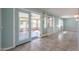 Bright sunroom with tiled floor and view of backyard at 12619 N Sun Valley Dr, Sun City, AZ 85351