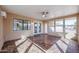 Bright sunroom with tiled floors and access to backyard at 12619 N Sun Valley Dr, Sun City, AZ 85351