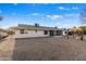 Large backyard with gravel and view of house exterior at 12630 W Crystal Lake Dr, Sun City West, AZ 85375