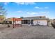 Backyard view showcasing a covered patio and gravel at 12630 W Crystal Lake Dr, Sun City West, AZ 85375