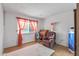 Bedroom with recliner, desk, and built in shelving at 12630 W Crystal Lake Dr, Sun City West, AZ 85375