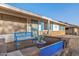 Front porch with blue bench and landscaping at 12630 W Crystal Lake Dr, Sun City West, AZ 85375