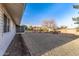 Side view of house showing screened patio and landscaping at 12630 W Crystal Lake Dr, Sun City West, AZ 85375