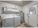 Laundry room with washer, dryer, and water heater at 12630 W Crystal Lake Dr, Sun City West, AZ 85375