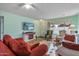 Living room featuring a fireplace and large TV at 12630 W Crystal Lake Dr, Sun City West, AZ 85375