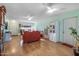 Bright living room with hardwood floors, comfy seating, and ceiling fans at 12630 W Crystal Lake Dr, Sun City West, AZ 85375