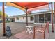 Relaxing patio space with seating and shade structure at 12630 W Crystal Lake Dr, Sun City West, AZ 85375