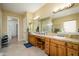 Spacious bathroom with double sinks, large vanity, and separate shower at 13105 W Micheltorena Dr, Sun City West, AZ 85375