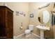 Powder room with pedestal sink and toilet at 13105 W Micheltorena Dr, Sun City West, AZ 85375