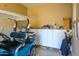 Garage with golf cart and additional storage at 13105 W Micheltorena Dr, Sun City West, AZ 85375