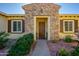 Front entrance with stone accents and landscaping at 13105 W Micheltorena Dr, Sun City West, AZ 85375