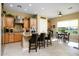 Spacious kitchen with granite countertops, island, and stainless steel appliances at 13105 W Micheltorena Dr, Sun City West, AZ 85375