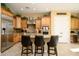 Island kitchen with granite countertops and stainless steel appliances at 13105 W Micheltorena Dr, Sun City West, AZ 85375