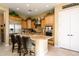 Kitchen features granite countertops and ample wood cabinetry at 13105 W Micheltorena Dr, Sun City West, AZ 85375