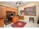 Home office with built-in wooden cabinets and desk at 13105 W Micheltorena Dr, Sun City West, AZ 85375