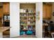 Well-organized pantry with ample shelving for storage at 13105 W Micheltorena Dr, Sun City West, AZ 85375