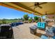 Relaxing patio with pool, seating area, and golf course view at 13105 W Micheltorena Dr, Sun City West, AZ 85375