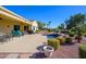 Relaxing pool area with patio furniture and golf course view at 13105 W Micheltorena Dr, Sun City West, AZ 85375