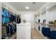 Large walk-in closet with ample shelving and hanging space at 13105 W Micheltorena Dr, Sun City West, AZ 85375