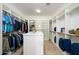 Large walk-in closet with ample shelving and hanging space at 13105 W Micheltorena Dr, Sun City West, AZ 85375