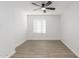 Bright bedroom with ceiling fan and wood-look floors at 14203 N 19Th Ave # 1051, Phoenix, AZ 85023