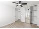 Bedroom with mirrored closet and ceiling fan at 14203 N 19Th Ave # 1051, Phoenix, AZ 85023