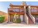 Attractive condo building with a private balcony and stairs at 14203 N 19Th Ave # 1051, Phoenix, AZ 85023