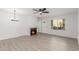 Living room with fireplace and wood-look flooring at 14203 N 19Th Ave # 1051, Phoenix, AZ 85023