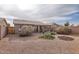 Spacious backyard with gravel, landscaping, and patio at 1486 E Augusta Ave, Chandler, AZ 85249