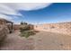 Large backyard with gravel, shrubs, and block wall at 1486 E Augusta Ave, Chandler, AZ 85249