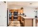 Kitchen with stainless steel appliances and wood cabinets at 1486 E Augusta Ave, Chandler, AZ 85249