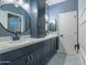 Double vanity bathroom with modern fixtures and patterned tile floor at 1618 E Montoya Ln, Phoenix, AZ 85024