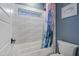 Bathroom with white wave tile, bathtub, and patterned shower curtain at 1618 E Montoya Ln, Phoenix, AZ 85024