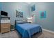 Serene bedroom with light blue walls and ample natural light at 1618 E Montoya Ln, Phoenix, AZ 85024