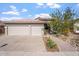 Attractive single-story home with a three-car garage and landscaped front yard at 1618 E Montoya Ln, Phoenix, AZ 85024