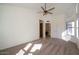 Spacious bedroom with large windows and ceiling fan at 1636 E Juanita Ave, Mesa, AZ 85204