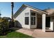 Front entry with brick walkway and a brown door at 1636 E Juanita Ave, Mesa, AZ 85204