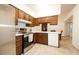 Kitchen features stainless steel appliances and ample wood cabinetry at 1636 E Juanita Ave, Mesa, AZ 85204