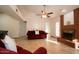 Living room with a brick fireplace, tile floors, and red couch at 1636 E Juanita Ave, Mesa, AZ 85204