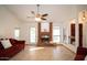 Living room with a brick fireplace and tile floors at 1636 E Juanita Ave, Mesa, AZ 85204