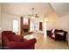 Living room with a brick fireplace and two red couches at 1636 E Juanita Ave, Mesa, AZ 85204