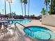 Community pool and spa with plenty of lounge chairs at 1636 E Juanita Ave, Mesa, AZ 85204