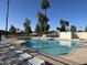 Community pool with plenty of lounge chairs for relaxation at 1636 E Juanita Ave, Mesa, AZ 85204