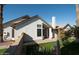 Rear view of the house, showcasing a patio and landscaping at 1636 E Juanita Ave, Mesa, AZ 85204