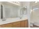 Bathroom with double vanity and light at 17840 W Calavar Rd, Surprise, AZ 85388