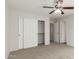 Well-lit bedroom featuring neutral carpeting and a large closet at 17840 W Calavar Rd, Surprise, AZ 85388