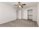 Well-lit bedroom with double door closet and ceiling fan at 17840 W Calavar Rd, Surprise, AZ 85388