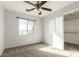 Bedroom with ceiling fan, closet, and natural light at 17840 W Calavar Rd, Surprise, AZ 85388